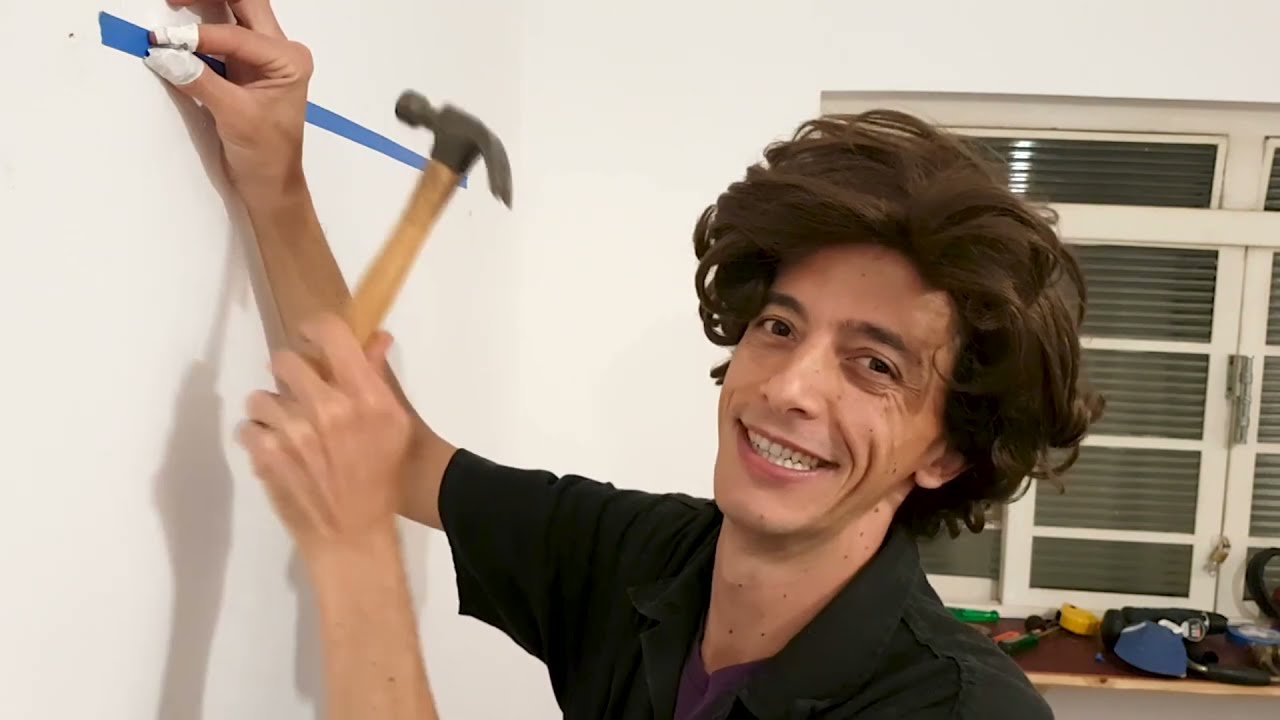 Como instalar um quadro na parede.
