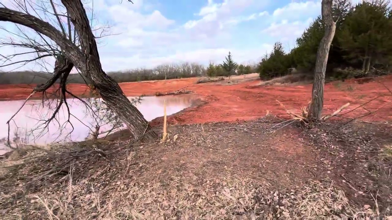 Raising the dam 7 feet and making this .34 of an acre pond almost 1 acre.