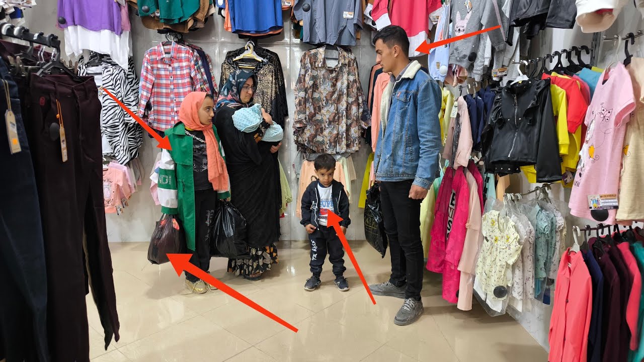 Kind shopkeeper: buying stylish clothes for a nomadic family