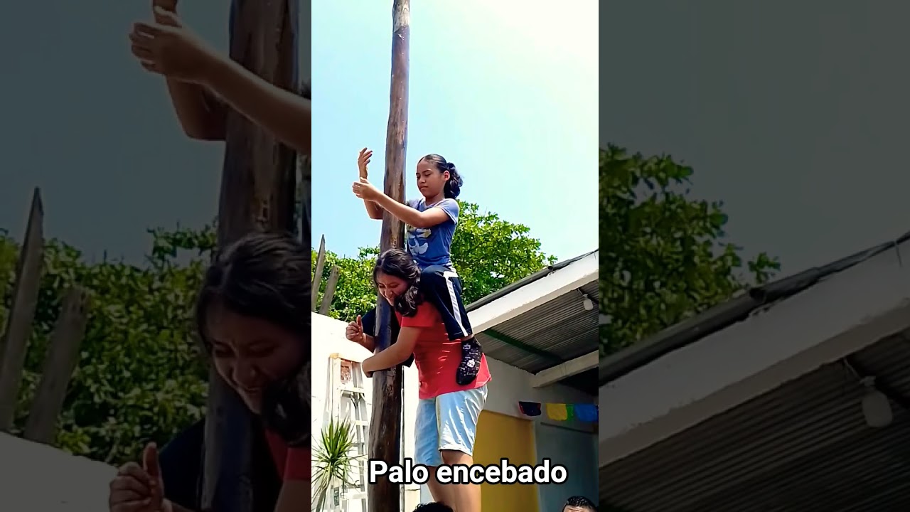 niñas que se caen por treparse al palo encebado