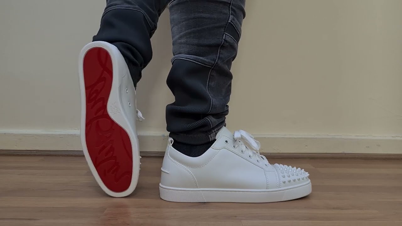 CHRISTIAN LOUBOUTIN WHITE LOUIS JUNIOR SPIKE FLAT CALF LOW SNEAKER ON FOOT