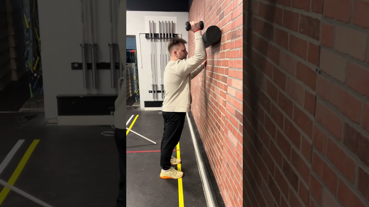 Foam roll assist dumbbell shoulder press