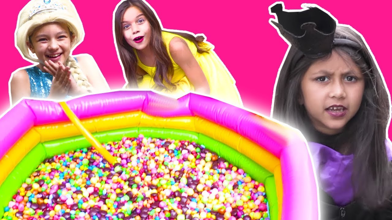 MAGIC PADDLING POOL FILLS WITH M&Ms CHOCOLATE AND SKITTLES CANDY - Princesses In Real Life