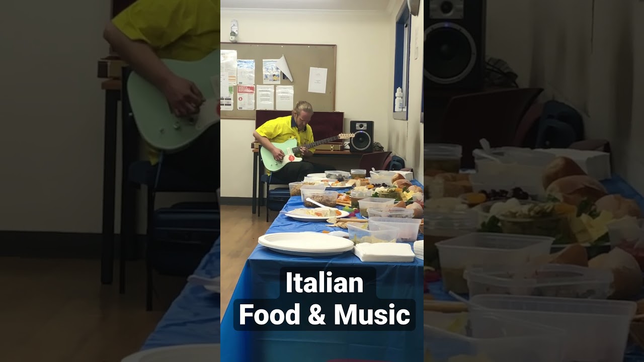 Famous guitarist at Italian food and music party