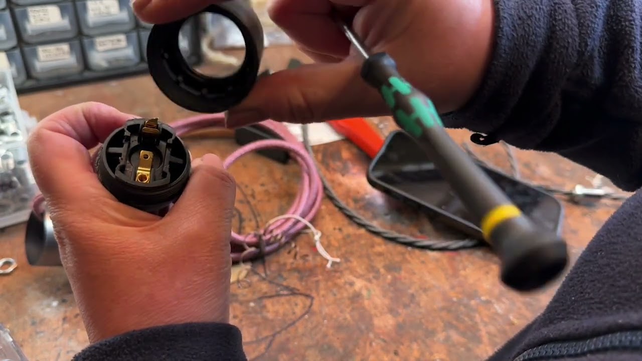 Changing a light bulb when the lamp holder has an additional decorative sleeve or cover.