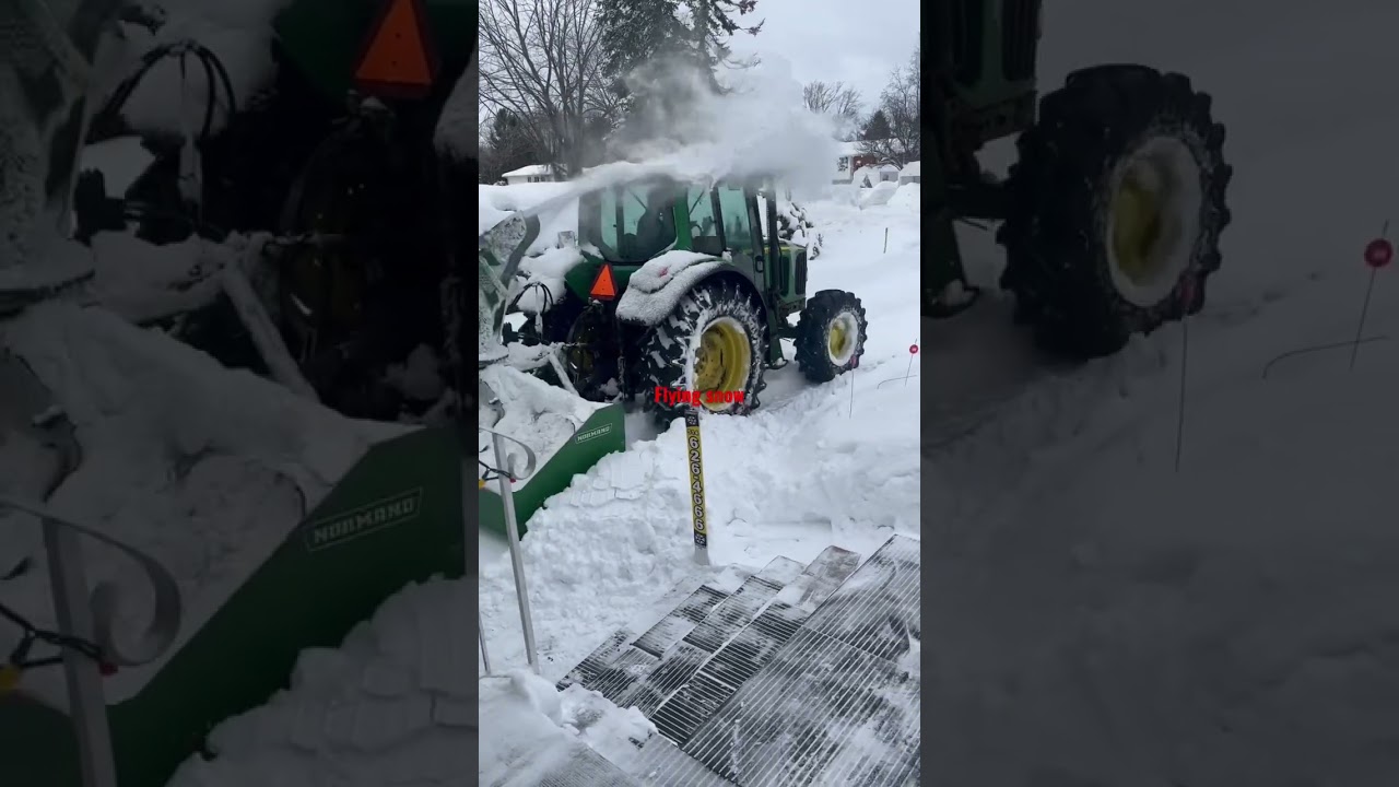 Tractor flying snow 