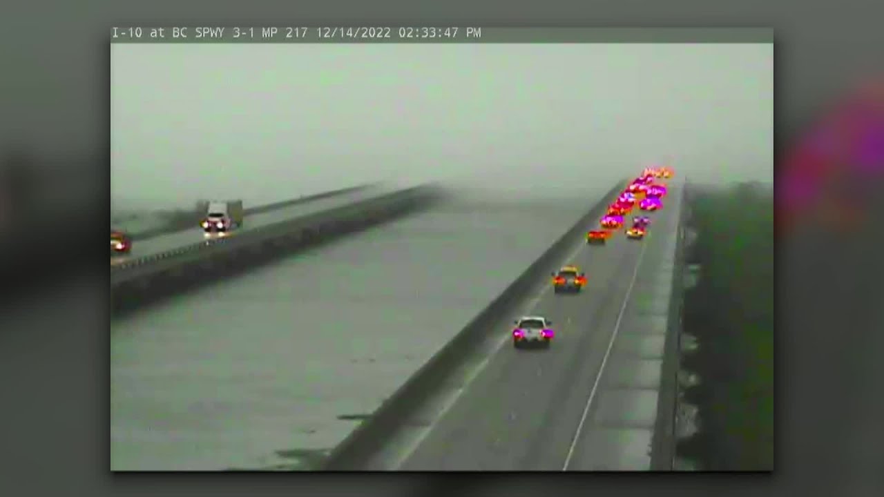 Rain-wrapped tornado moves over Bonnet Carre Spillway Bridge