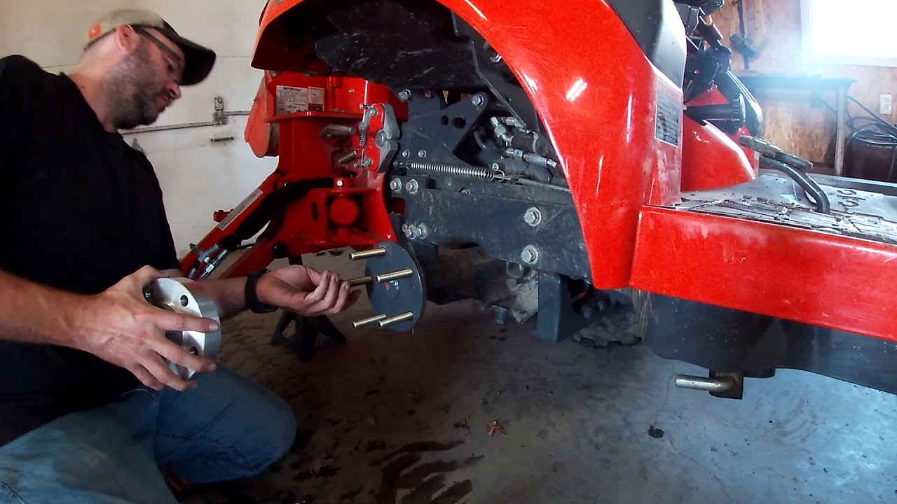 Kubota BX23S wheel spacers and tire chains installation.