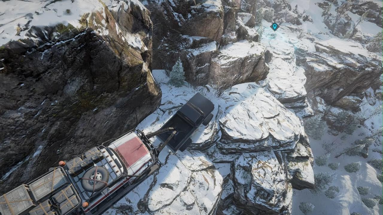 SnowRunner_Square body tows F750 on rocky ledge.