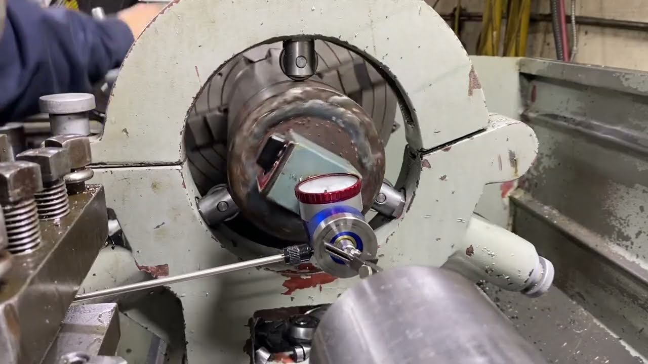 Co-ax on lathe, dial that part into the steady rest the easy way. 