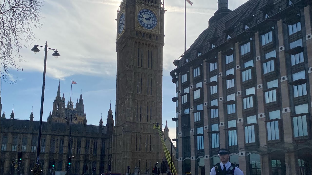 Big Ben chimes throughout the day as protester sits a quarter way up the tower 8/3/2025