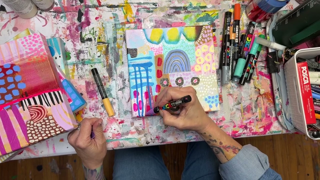 Finishing Touches on original abstract artworks with posca pens