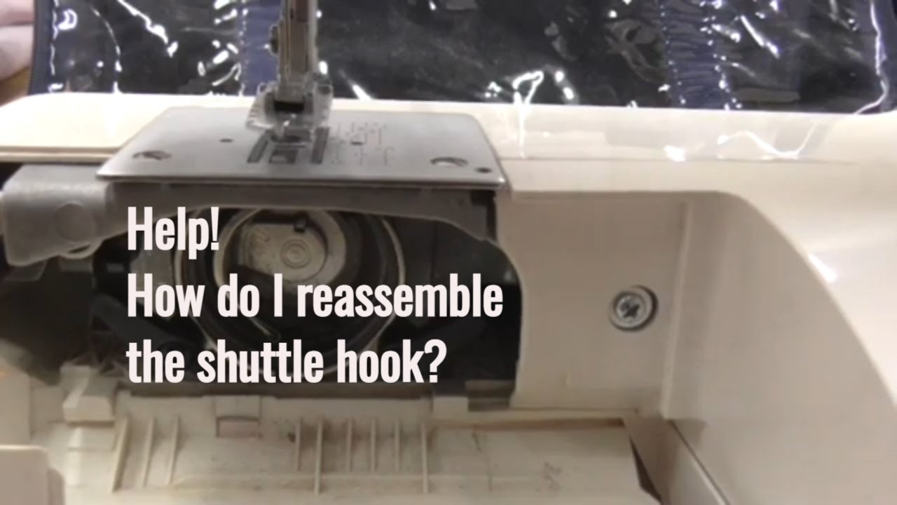 How to reassemble the shuttle hook and cover on a Toyota Quiltmaster