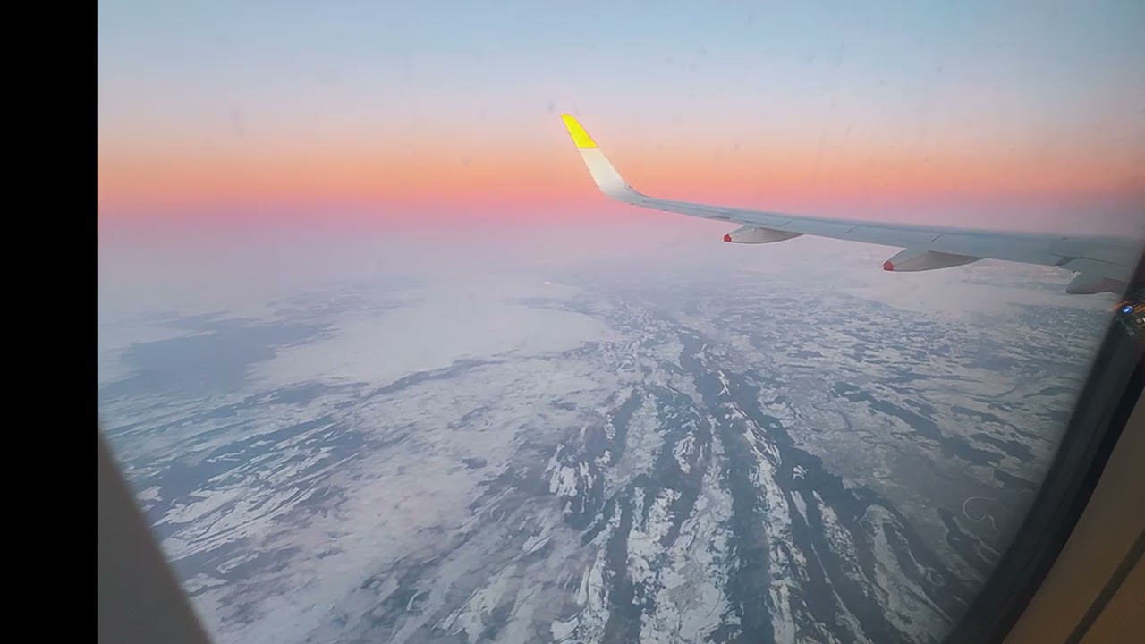 Tramonto + Alpi innevate dall'aereo