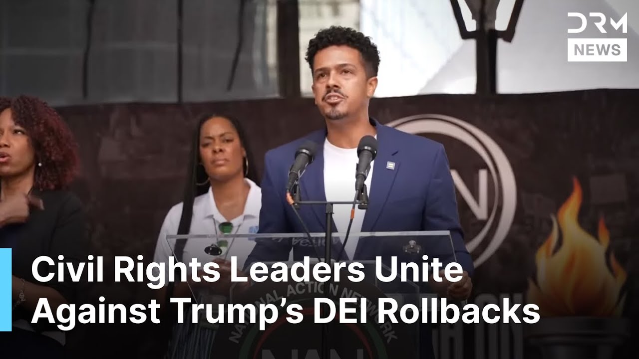 «Нас не сотрут»: лидеры движения за гражданские права маршируют на Уолл-стрит против сокращений ф...