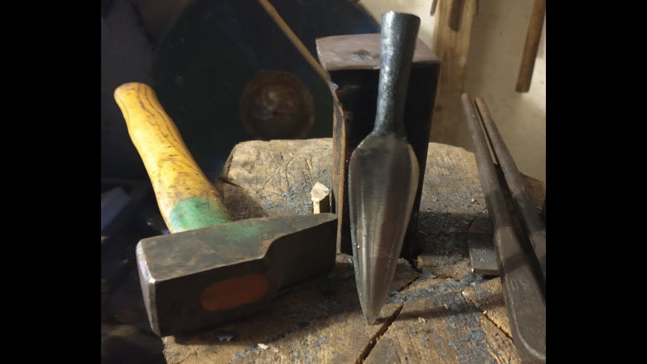 Forging a tiny spear or big arrow head on early medieval anvil
