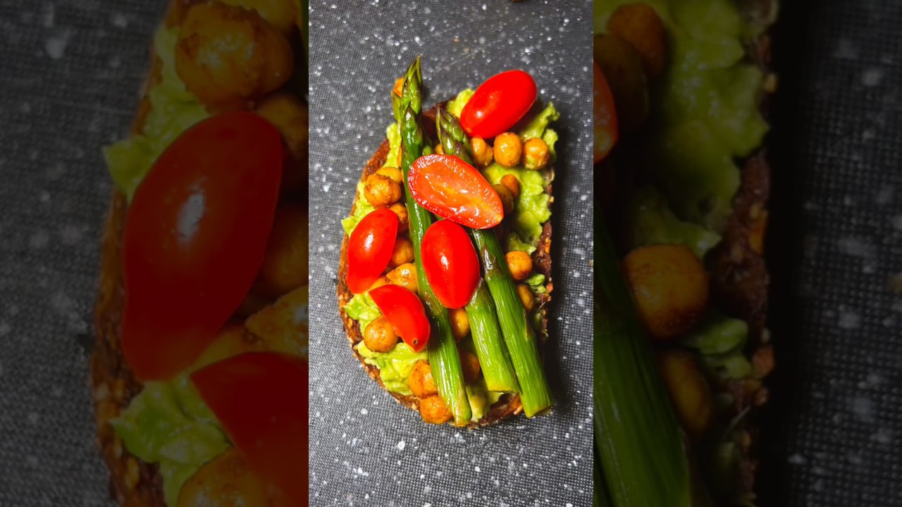 Smashed avocado on toast, topped with spicy chickpeas, plum tomatoes and sautéed asparagus. Enjoy!
