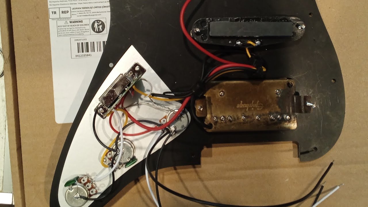 Replacement of Stock pickups in a pre-wired pick guard, with Epiphone branded pickups.