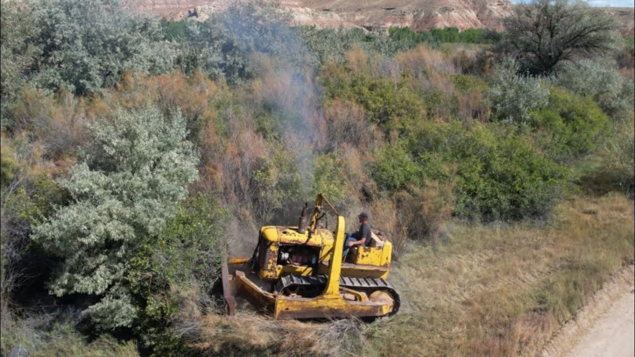 Loosening the track, then pushing some dirt with the old dozer.  1940's Allis Chalmers HD10