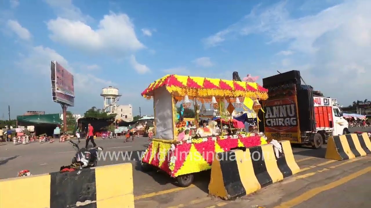 Experience Kanwar Yatra in Haridwar Yatri Walks Amid Makeshift Stalls and Structures