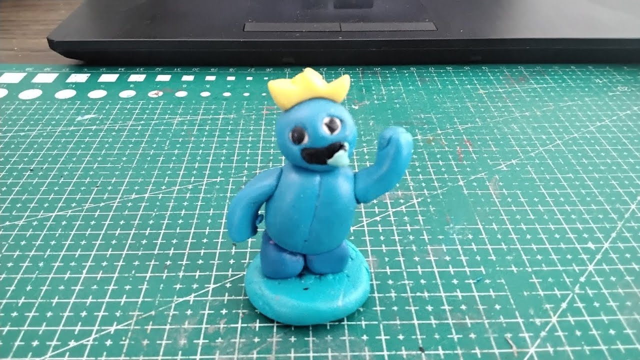Die polymer clay blue rainbow friends.