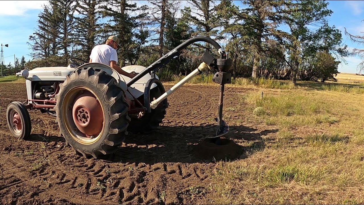 Ford Jubilee runs the post hole Auger