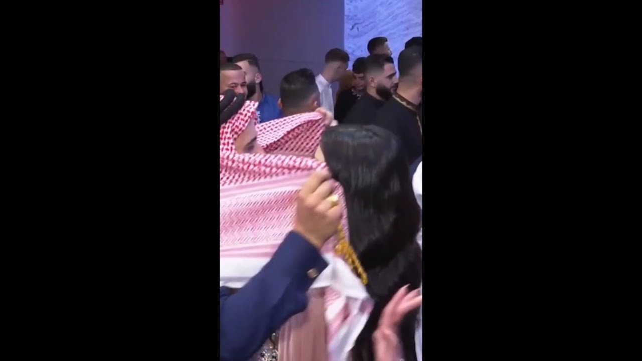 Arab sheikh dancing with girls in night club