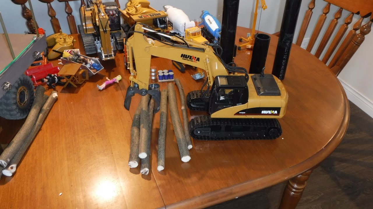Huina 570 Rc 16 ch 2.4 Ghz 1/12  logger excavator pushing the limits