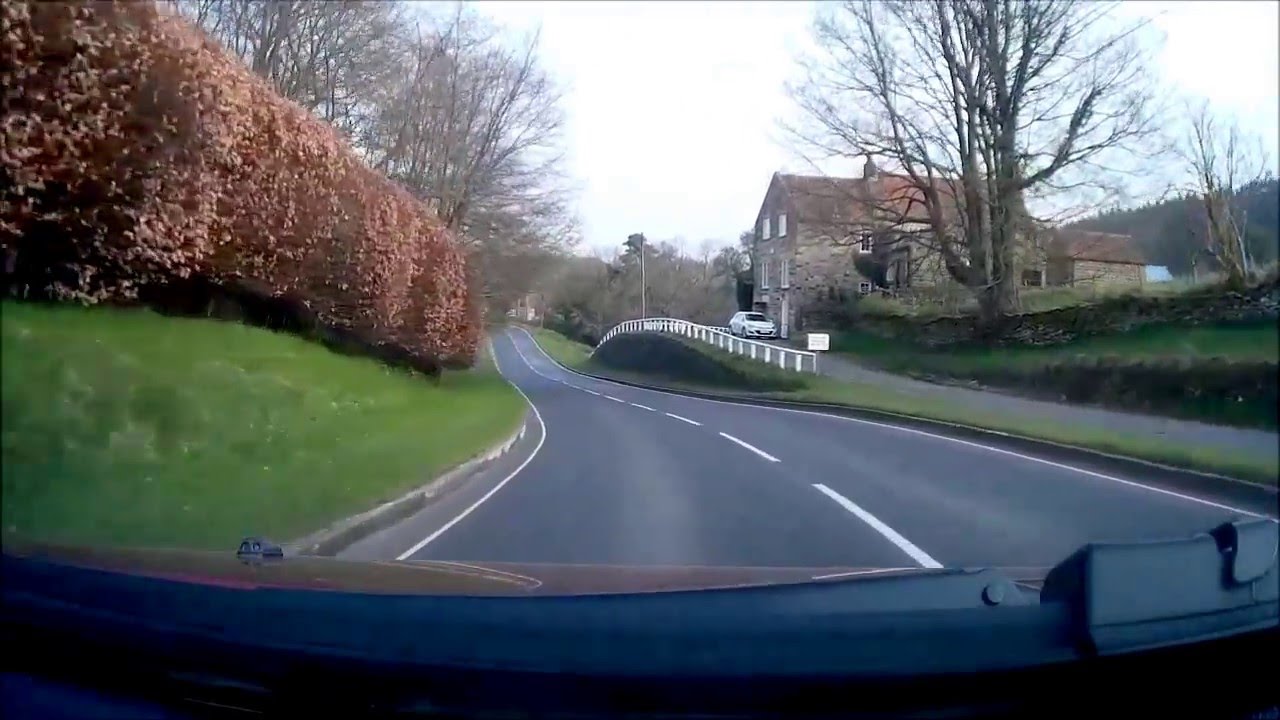 Car journey through North Yorkshire countryside and villages.