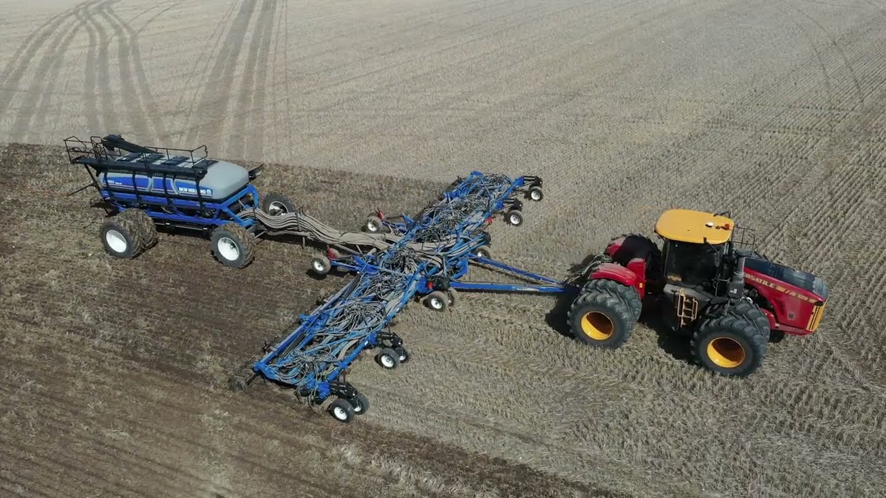 Seeding in Saskatchewan with a Versatile Tractor and  New Holland Air Drill