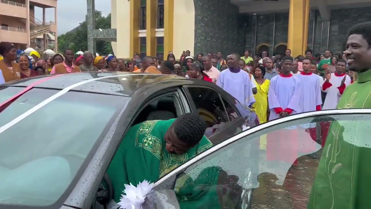 FR. EBUBE MUONSO GIFTS HIS FIRST SEMINARIAN A BRAND NEW CAR AS HIS PRIESTLY ORDINATION GIFT.