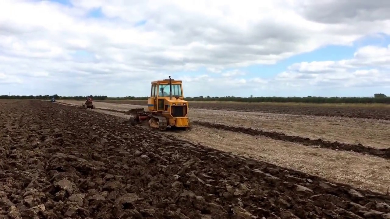 Track Marshall 135 pulling Crawford 5 furrow trailed plough