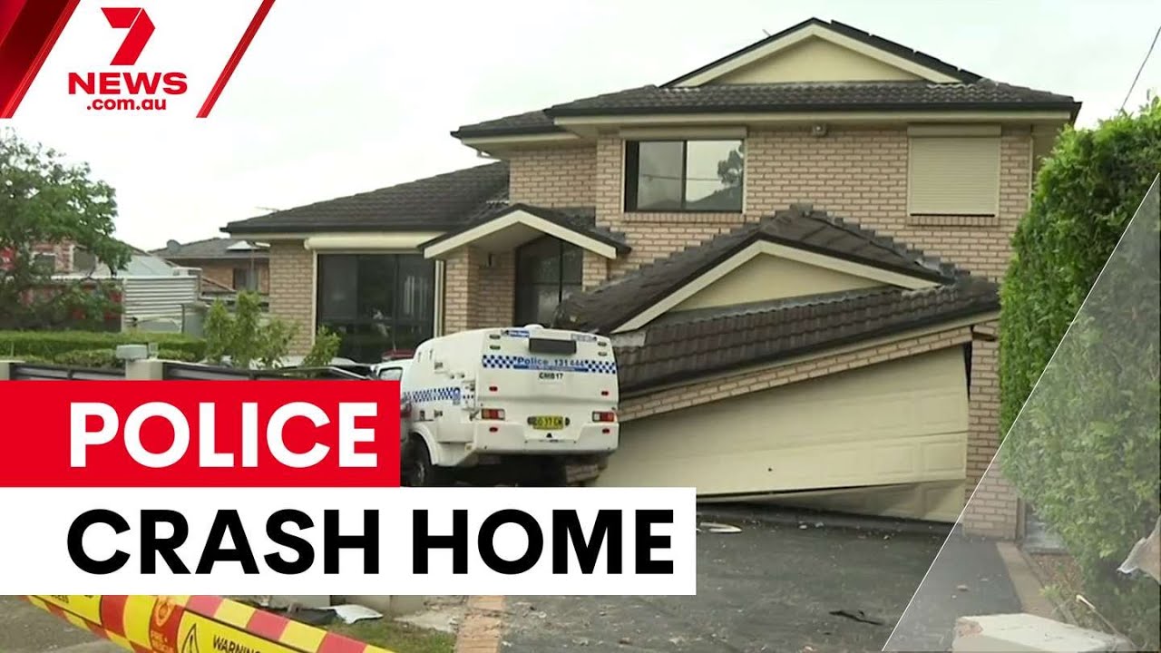 Police car ploughs through Merrylands home | 7NEWS