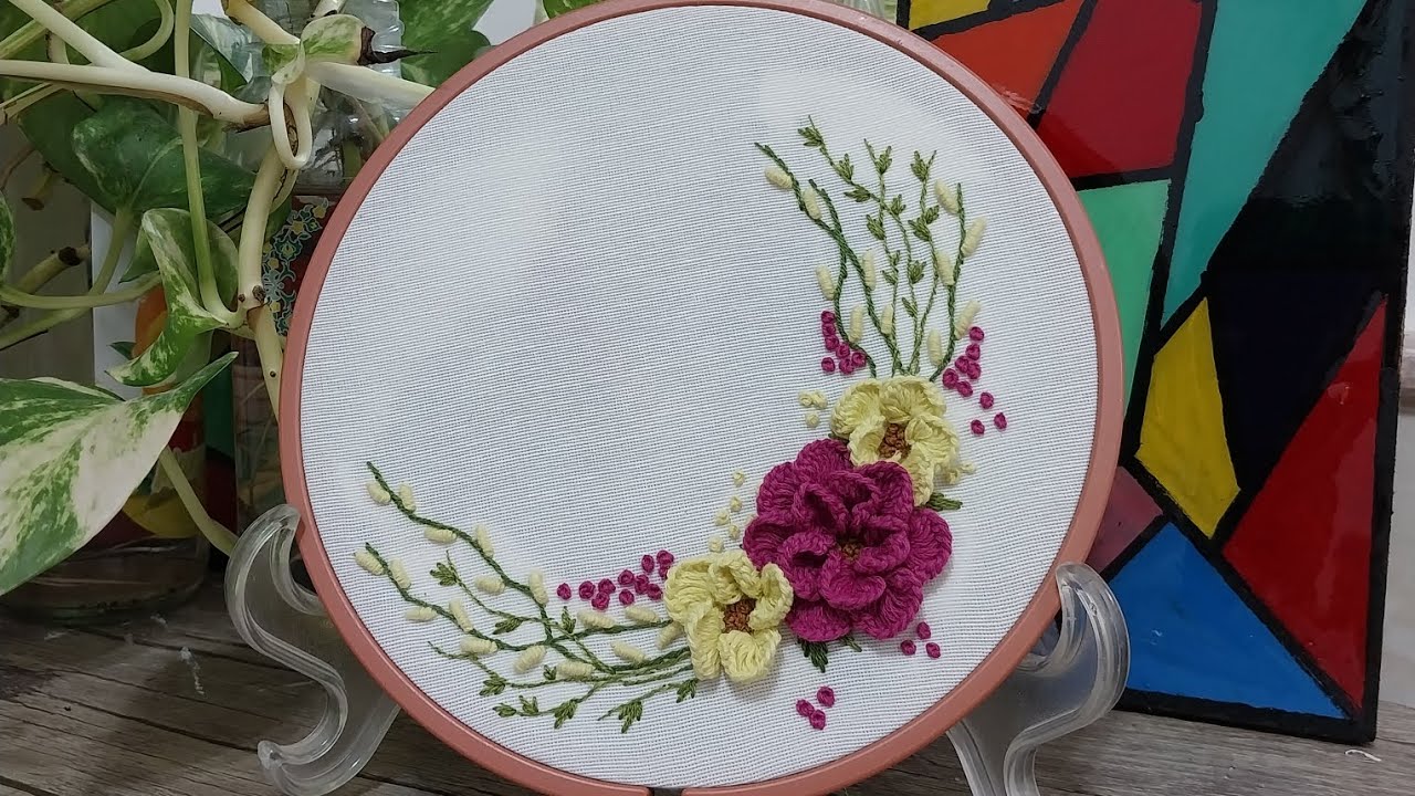Embroidery of a beautiful painting of yellow and red roses