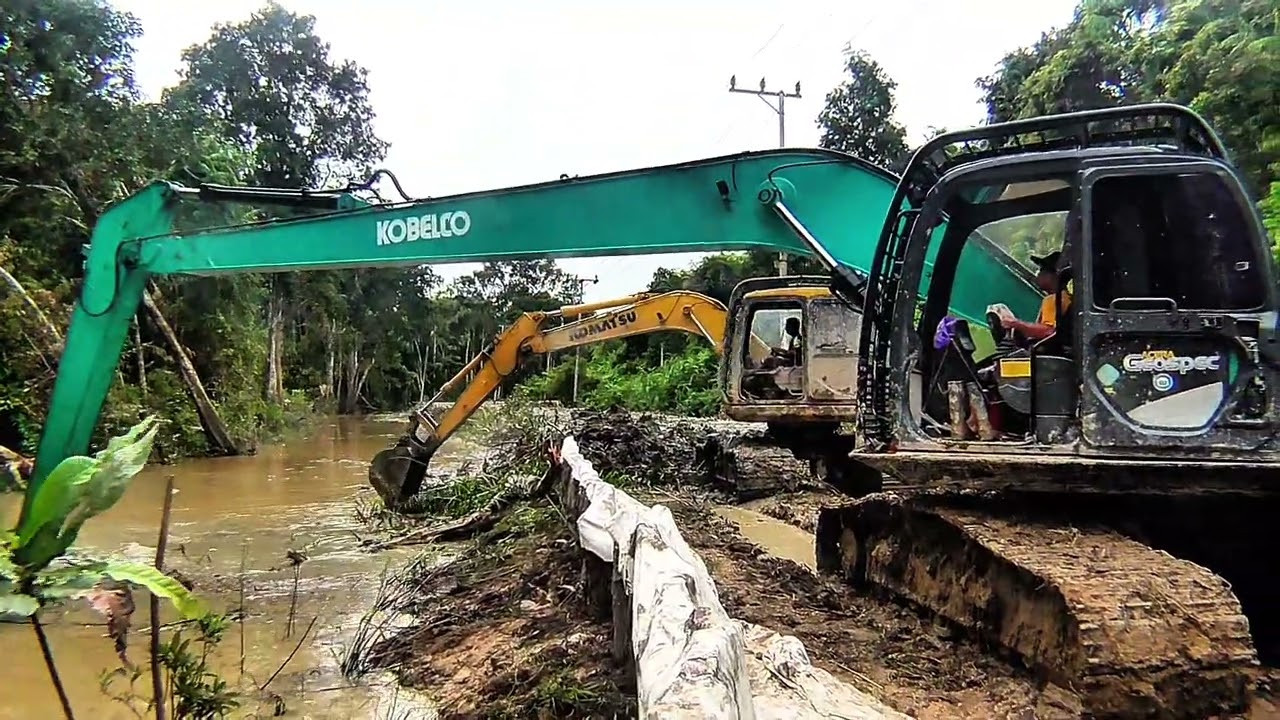 Long arm bikin peninggian jalan di kebun rotan