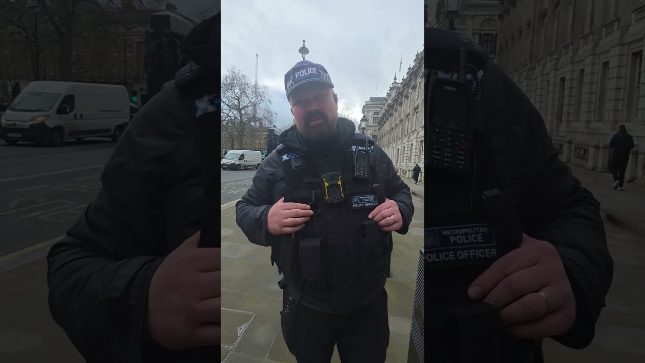 Допрашивается сотрудниками полиции дипломатической охраны в кабинете министров Великобритании.