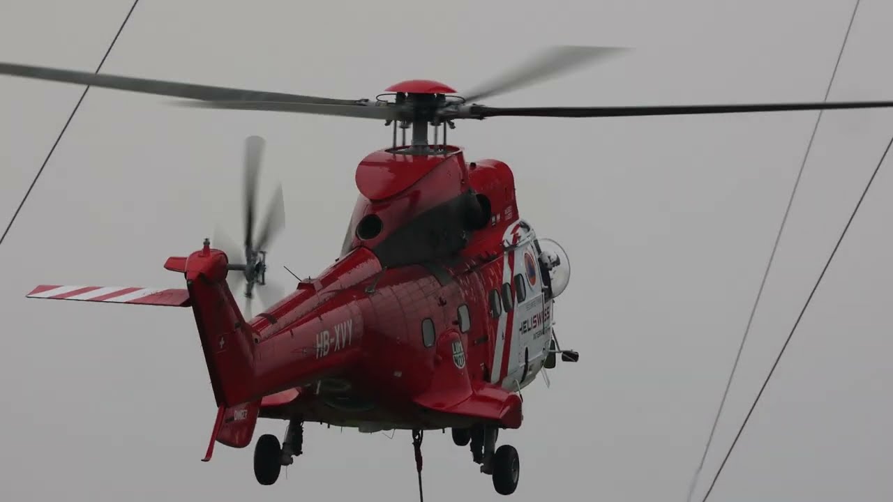 Super Puma helicopter takes off from Emley Moor mast to remove temporary mast section