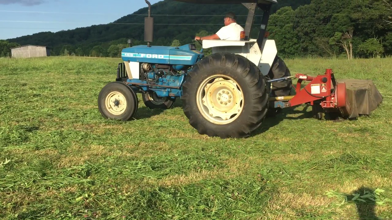 4610 ford tractor mowing red clover hay