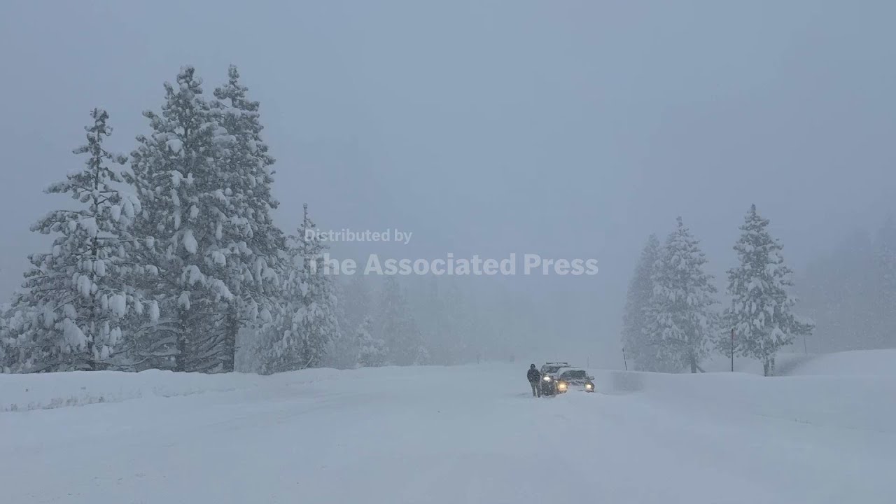 Motorists hampered by heavy snow along Interstate 80 in the Sierra Nevada mountains