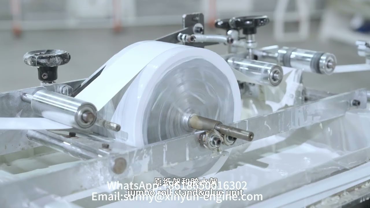 China advanced non stop toilet tissue paper / kitchen towel roll machine production line