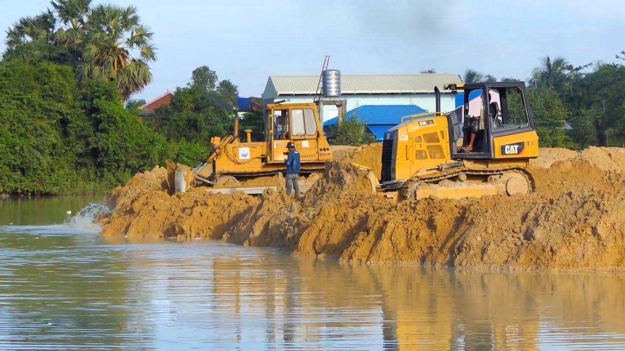 Good job, Bulldozer CAT Komatsu working Push the soil into the water & Big Dump Truck 25ton