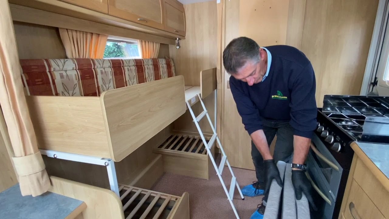 Side dinette bed demonstration in a Lunar Quasar