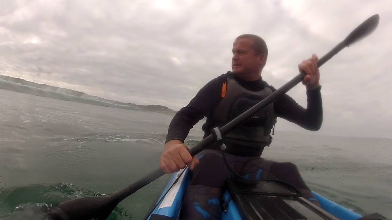 Backline entry through big surf on an Erics GT fishing kayak.Myoli beach South Africa