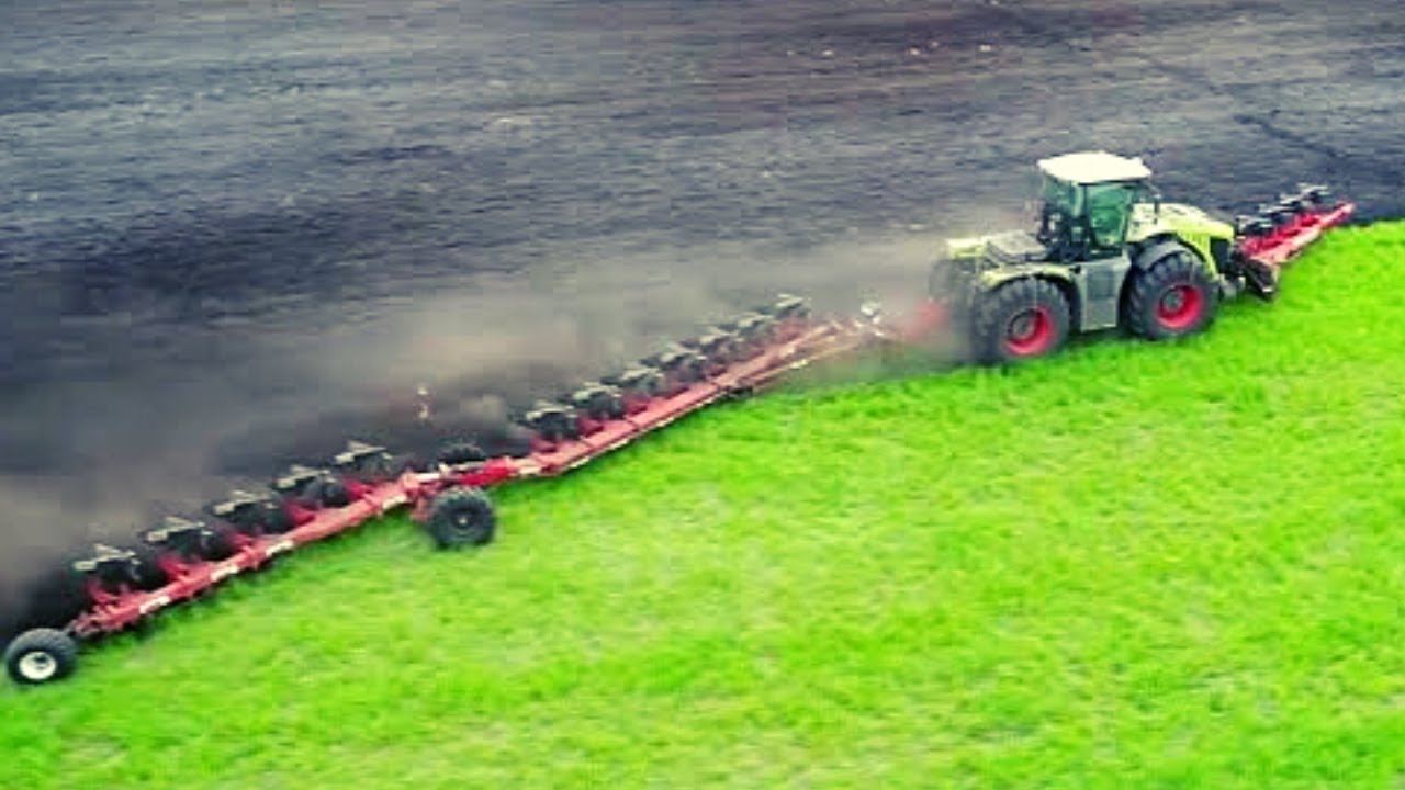CLAAS XERION 5000 Plowing the Field - Powerful Machines in Action