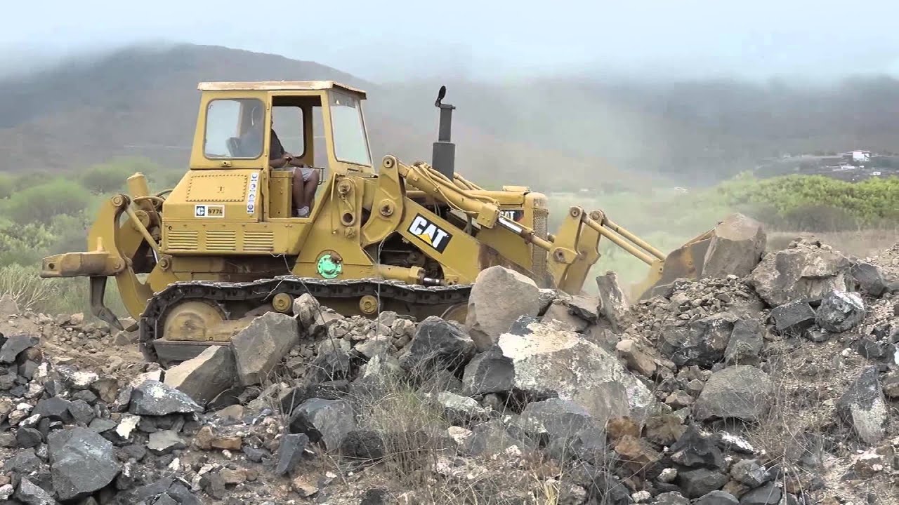 Caterpillar 977L Crawler Shovel moving volcanic rock on Tenerife
