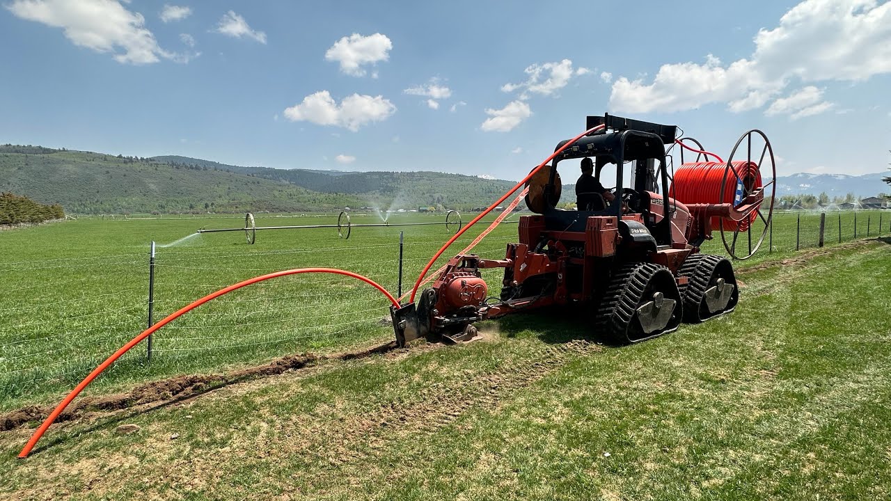 Plowing conduit with a ditch witch