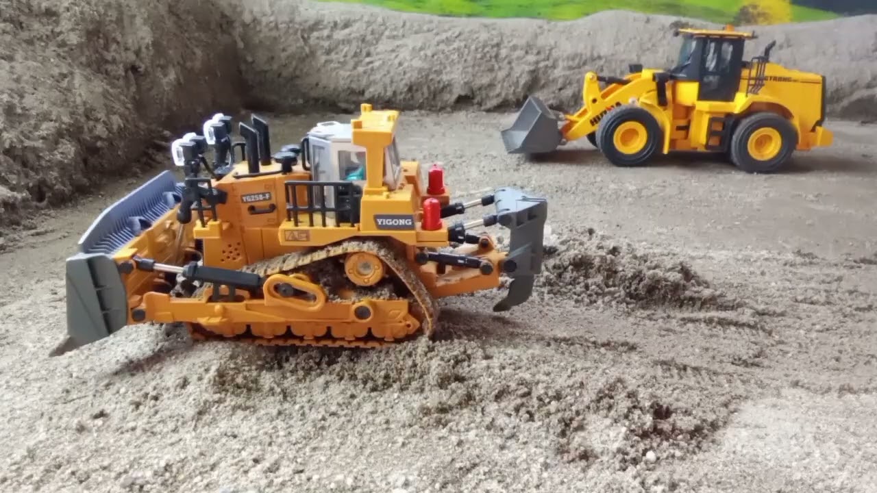 The rc bulldozer is tasked with leveling the land at the mine site.