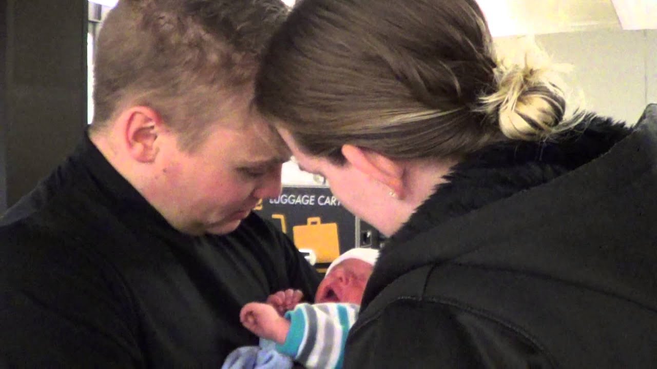 Sailor meeting newborn son