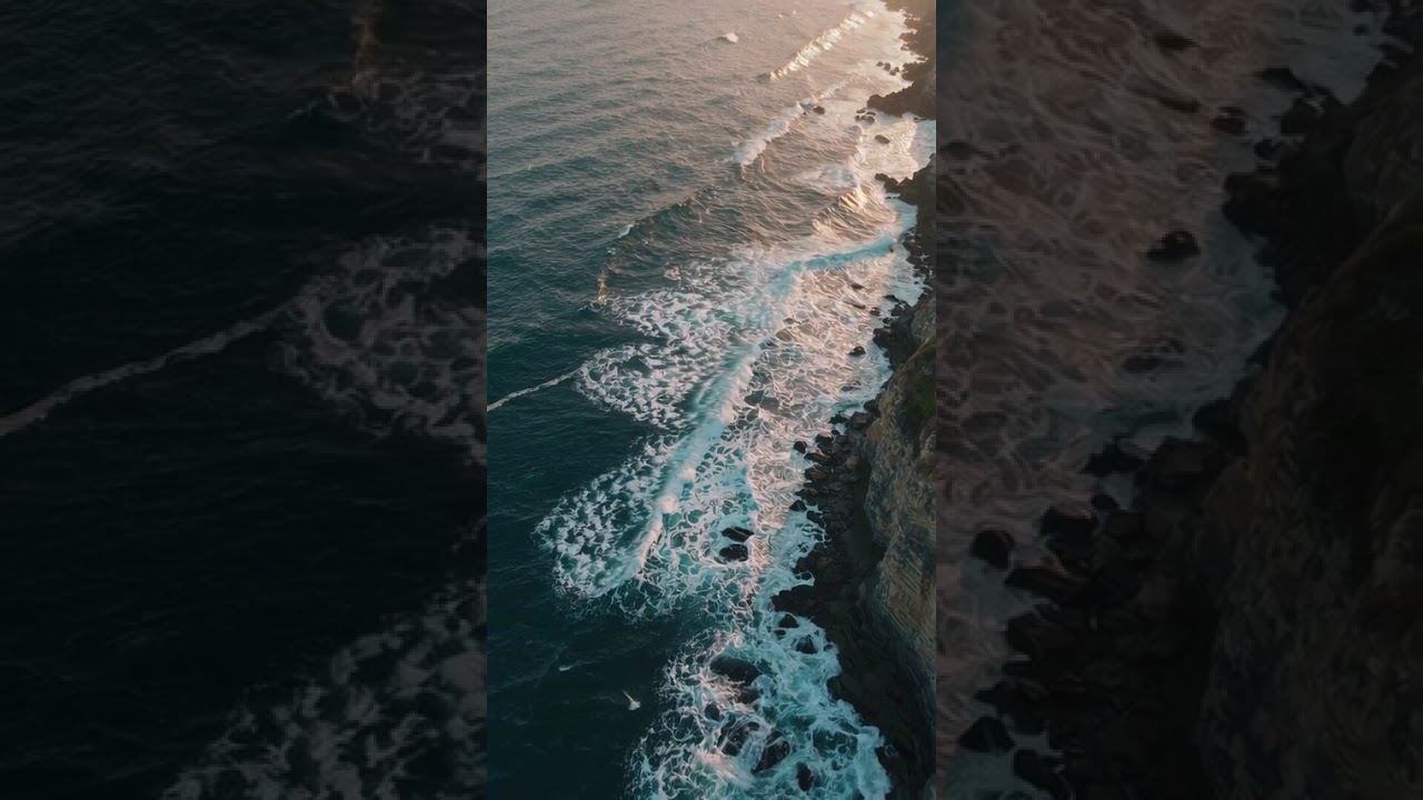 Waves Crashing Against a Rugged Coastline at Sunset