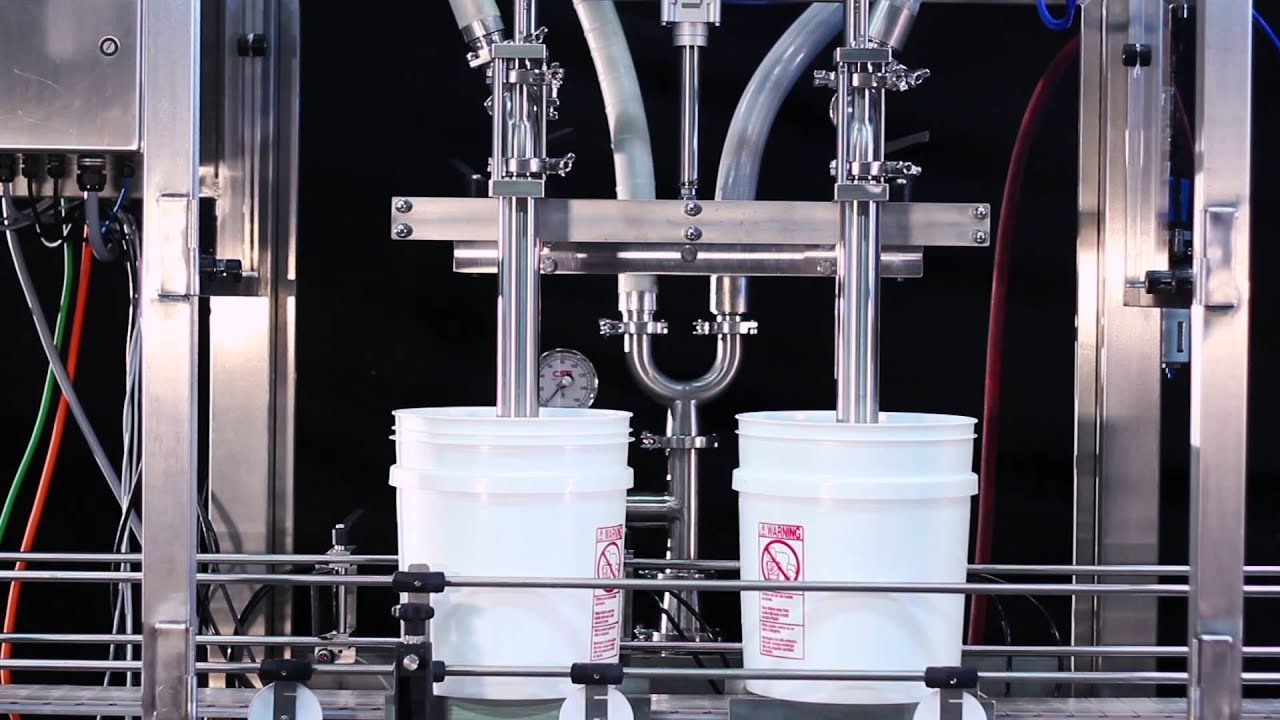 Pacific Packaging – Two-Station Net Weight Inline Pail Filler with Lidding System, Food Products